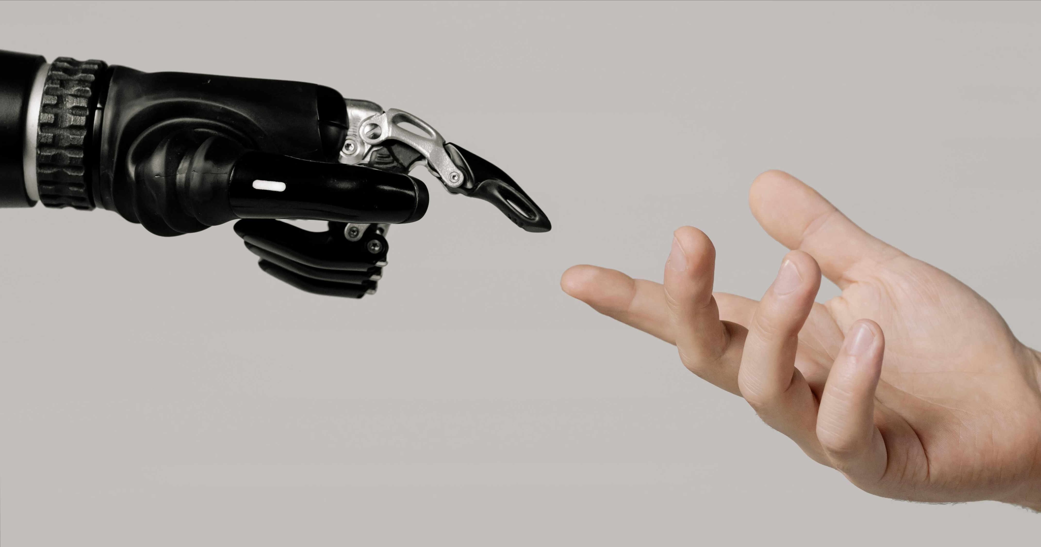 robot hand touching human hand